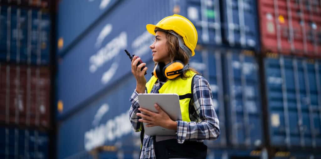 Female workers in the container industry transporting imports and exports of goods to the shipping business.